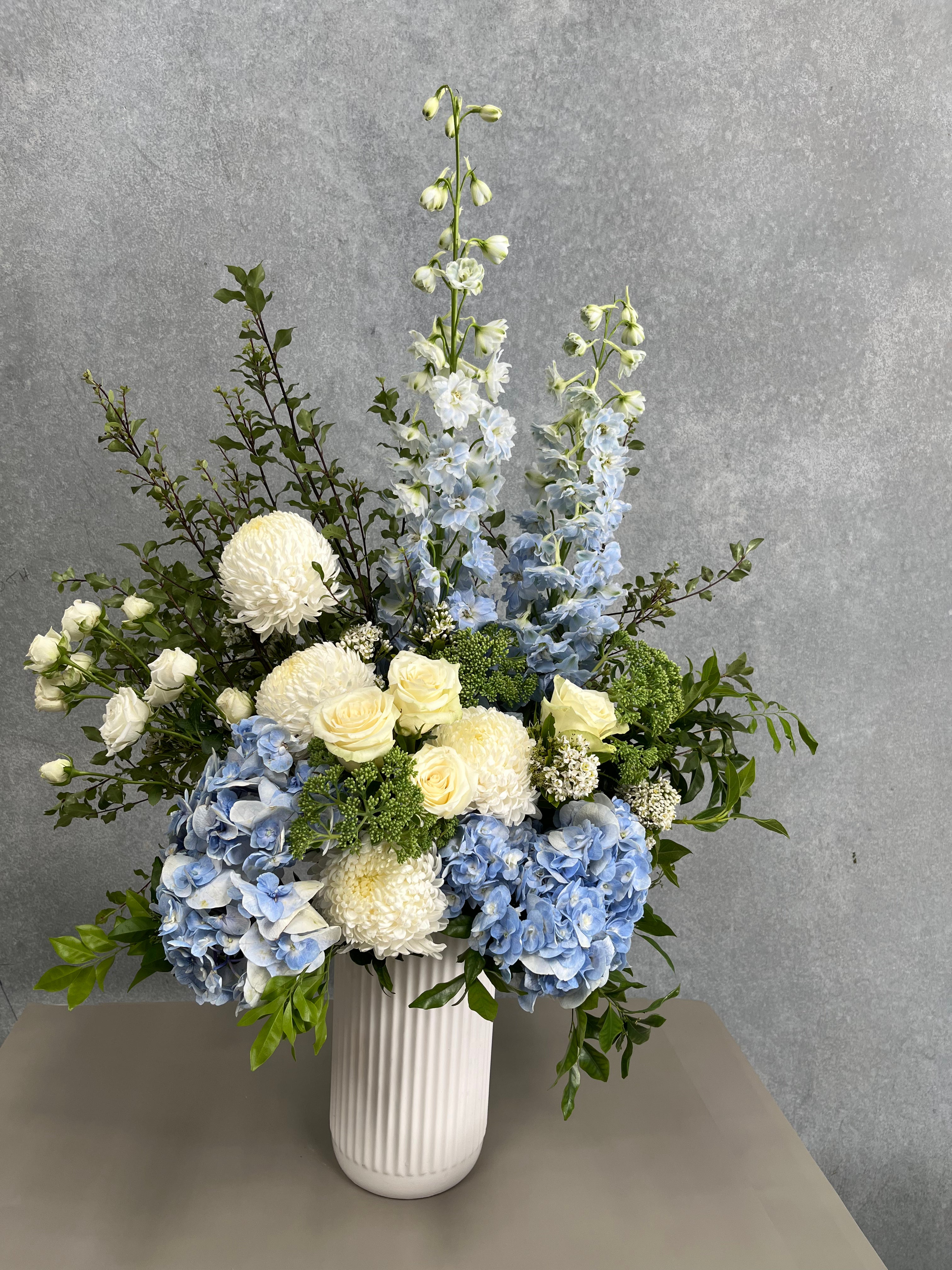 flower arrangement in blues and white