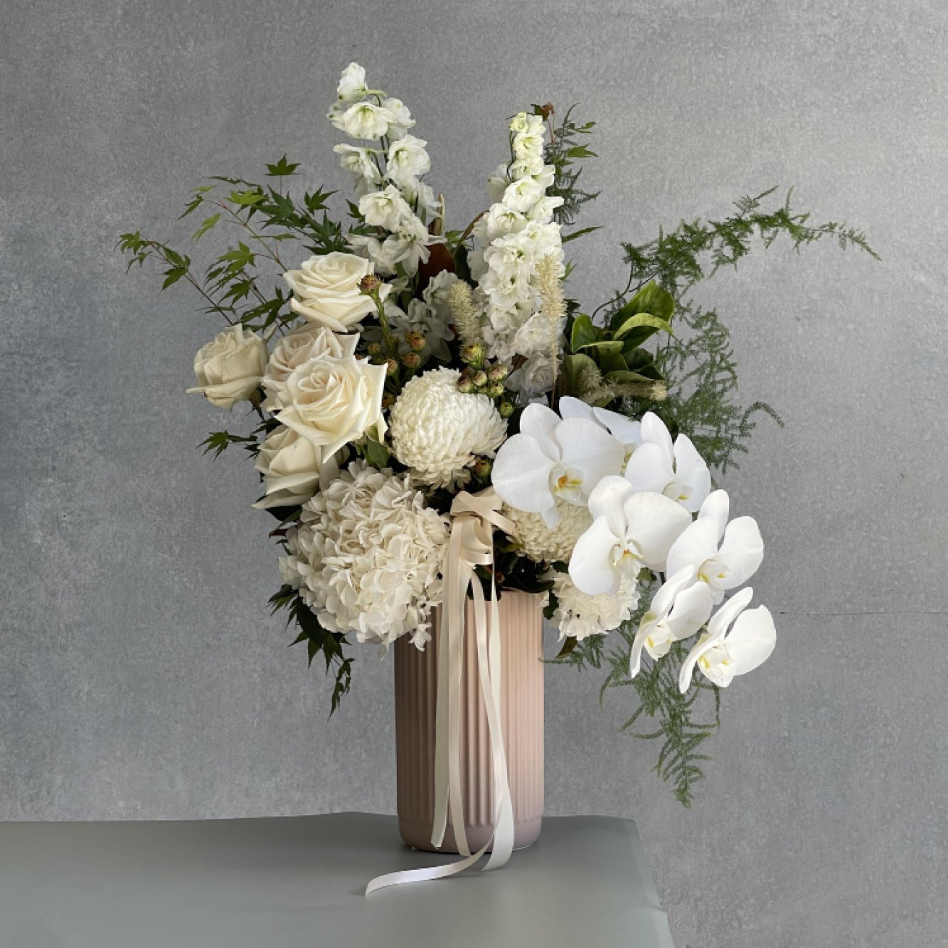 Soft neutral floral arrangement. Lavish size. Suitable for any event or occasion.
